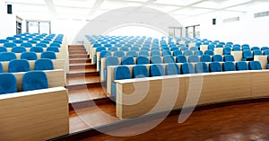 Empty college lecture hall with chairs photo