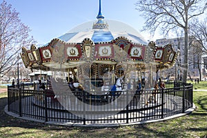 An empty, colorful, old fashion carousel for kids in a park in Philadelphia
