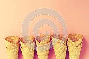 Empty Colorful Pastel Toning Ice Cream Cones on Pink Background.