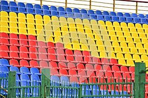 Empty colorful seats in the stands of the stadium. The concept of the end, the beginning of the match, the competition. The end of