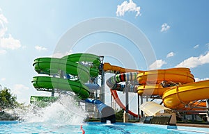 Empty colorful waterslides and pool