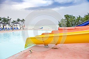 Empty colorful waterslides and pool