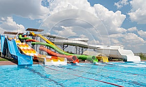 Empty colorful waterslides and pool