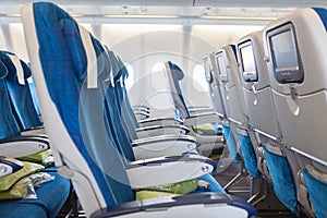 Empty comfortable seats in cabin of aircraft