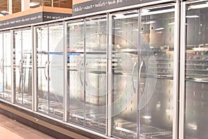 Empty commercial fridges at grocery store in America