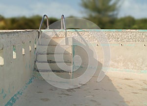 An empty concrete swimming pool