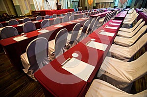 Empty conference hall with red table