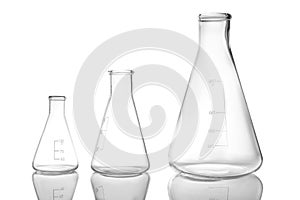 Empty conical flasks on background. Laboratory glassware