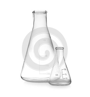 Empty conical flasks on white background