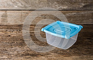 Empty containers for food on wooden background