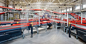 Cardboard boxes on conveyor belt.parcels transportation system concept photo