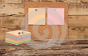 Empty cork board with colorful stack note papers