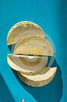 Empty corn taco shell in a blue background