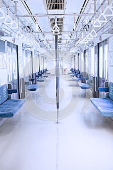 Empty corridor inside commuter train