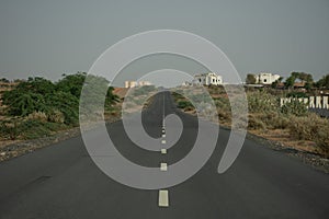 Empty country desert road looking uphill. Concept for moving forward, empty, unseen finish, desolate, lost