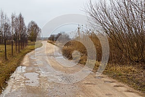 Empty country, field road in winter. Latvian