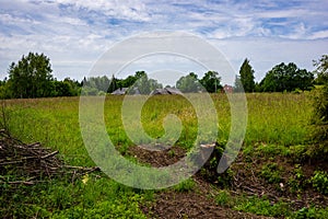 empty countryside landscape in autumn with fields and meadows and rare trees in background