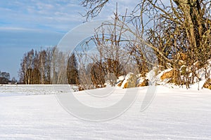 Empty Countryside Landscape in Sunny Winter Day with Snow Covering the Ground, Abstract Background with Deep Look and Dramatic