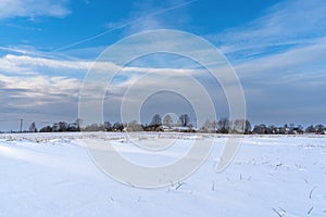 Empty Countryside Landscape in Sunny Winter Day with Snow Covering the Ground, Abstract Background with Deep Look and Dramatic