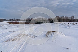 Empty Countryside Landscape in Sunny Winter Day with Snow Covering the Ground, Abstract Background with Deep Look and Dramatic