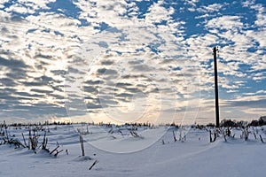 Empty Countryside Landscape in Sunny Winter Day with Snow Covering the Ground with Power Lines in Frame, Abstract Background with