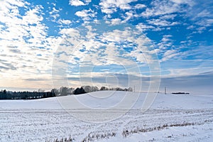 Empty Countryside Landscape in Sunny Winter Day with Snow Covering the Ground with Power Lines in Frame, Abstract Background with