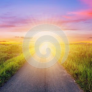 Empty countryside road and sunset sky photo