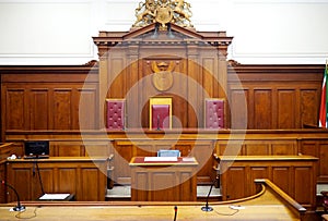 Empty courtroom, with old wooden paneling photo