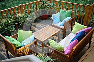 Empty cozy terrace with couch, table, chairs with