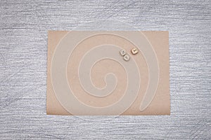 Empty craft paper on grey background, copywritting. Looking for ideas, writting work
