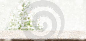 Empty cream marble table top with abstract muted blur christmas