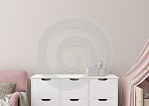 Empty cream wall in modern child room. Mock up interior in scandinavian style. Copy space for your picture or poster