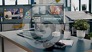 Empty creative multimedia studio with professional computer placed on desk