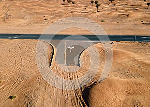 Empty crossroad in the UAE desert aerial view
