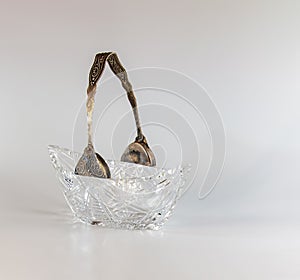 Empty crystal candy bowl on a white background. The vase was made in the mid-20th century photo