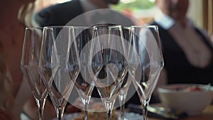 Empty crystal glasses at the table for drinks and alcoholic beverage.