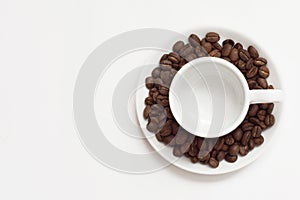 Empty cup with coffee beans.