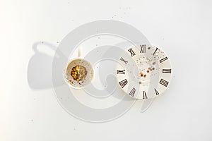 Empty cup of coffee on small plate on white background