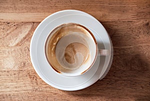Empty cup of coffee on wooden table