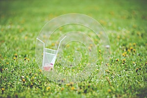 Empty cup from drinks with straws