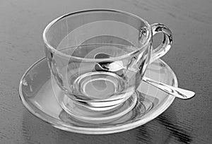 Empty cup on saucer with teaspoon