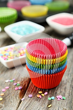 Empty cupcake cases on the colorful background