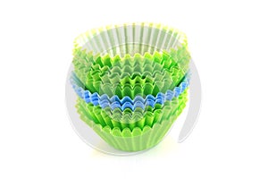 Empty cupcake cups in green and blue