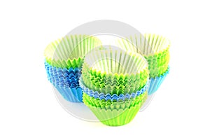 Empty cupcake cups in green and blue