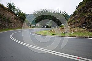 Empty curved road in small village on the Pacific Coast of Chile