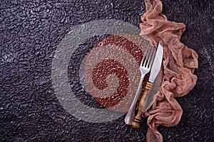 Empty cutting board or plate with cutlery on concrete background