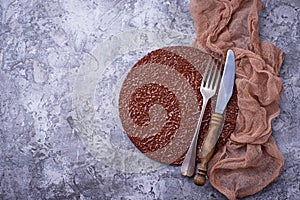 Empty cutting board or plate with cutlery on concrete background