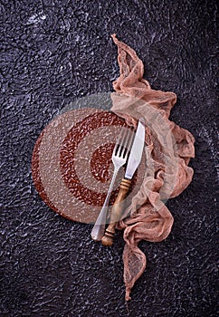 Empty cutting board or plate with cutlery on concrete background