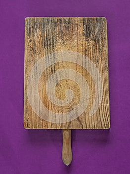 Empty cutting board on purple
