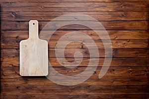 Empty cutting board on vintage dark wooden board food background concept